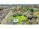 Aerial view of the complex, showing the buildings, parking, pool, and green spaces of the community at 213 Landing Rd. # F, North Myrtle Beach, SC 29582