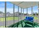 Balcony features a bench with cushions and white posts overlooking a well-kept yard at 213 Landing Rd. # F, North Myrtle Beach, SC 29582