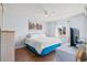 Bedroom featuring a large bed, a ceiling fan, hardwood floors, and a window for natural lighting at 213 Landing Rd. # F, North Myrtle Beach, SC 29582
