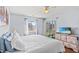 This bedroom features a ceiling fan, large windows, and access to the outdoor screened in porch at 213 Landing Rd. # F, North Myrtle Beach, SC 29582