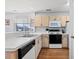 Bright kitchen featuring matching appliances and wood cabinets, perfect for culinary creations at 213 Landing Rd. # F, North Myrtle Beach, SC 29582
