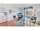 Inviting living area features hardwood floors, access to a bedroom and a sliding door to the outside at 213 Landing Rd. # F, North Myrtle Beach, SC 29582