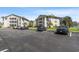 Ample parking is available in the paved lot, surrounded by manicured lawns and buildings at 213 Landing Rd. # F, North Myrtle Beach, SC 29582