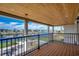 Covered balcony featuring stately columns and views of the channel and surrounding homes at 2417 Gist Ln., Myrtle Beach, SC 29588