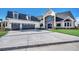 Beautiful two-story home with a manicured lawn, three-car garage, and grand entrance at 2417 Gist Ln., Myrtle Beach, SC 29588