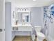 Bright bathroom with a white vanity, tiled floors, and an adjacent bedroom at 2501 South Ocean Blvd. # 1011, Myrtle Beach, SC 29577