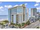 Stunning exterior view of an oceanfront building featuring multiple balconies and on-site parking at 2501 South Ocean Blvd. # 1011, Myrtle Beach, SC 29577