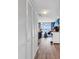 Hallway featuring a large closet leading into a brightly lit living room with ocean views at 2501 South Ocean Blvd. # 1011, Myrtle Beach, SC 29577