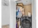 Efficient laundry closet featuring a front load washer and plenty of storage space at 2501 South Ocean Blvd. # 1011, Myrtle Beach, SC 29577