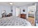 Bright bedroom features a bathroom entrance, ensuite access, and wood-look floors at 2501 South Ocean Blvd. # 1011, Myrtle Beach, SC 29577