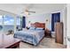 Bright main bedroom featuring sliding glass doors with ocean views and coastal decor at 2501 South Ocean Blvd. # 1011, Myrtle Beach, SC 29577