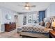 This main bedroom features a cushioned bench, balcony access, and ensuite bathroom at 2501 South Ocean Blvd. # 1011, Myrtle Beach, SC 29577