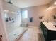 Bathroom with a large, tiled walk-in shower, dual vanity, and modern fixtures at 256 Copper Leaf Dr., Myrtle Beach, SC 29588