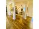 Open-concept dining room featuring elegant pillars, wood floors, and natural light at 256 Copper Leaf Dr., Myrtle Beach, SC 29588