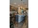 Kitchen boasts granite counters, stainless appliances, island with seating, and ample cabinet space at 256 Copper Leaf Dr., Myrtle Beach, SC 29588