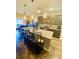 Open kitchen features a granite island with seating and stainless steel appliances at 256 Copper Leaf Dr., Myrtle Beach, SC 29588