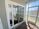 Screened porch with outdoor access and view of the lake at 256 Copper Leaf Dr., Myrtle Beach, SC 29588
