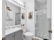 Well-lit bathroom with glass shower, vanity, and neutral colored paint at 300 Marsh Pl. # 302A, Garden City Beach, SC 29576