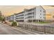 Spacious condo building on stilts featuring multiple balconies and ample parking at 300 Marsh Pl. # 302A, Garden City Beach, SC 29576