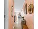 Hallway leads to the living area with hardwood floors and decorative accents at 300 Marsh Pl. # 302A, Garden City Beach, SC 29576