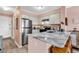 Modern kitchen features stainless steel appliances and marble countertops at 300 Marsh Pl. # 302A, Garden City Beach, SC 29576