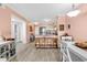Open kitchen with breakfast bar seating, stainless steel appliances, and lots of natural light at 300 Marsh Pl. # 302A, Garden City Beach, SC 29576