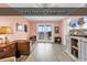 Cozy living room boasts sliding glass doors with balcony access and water views at 300 Marsh Pl. # 302A, Garden City Beach, SC 29576