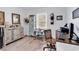 Home office features a wooden desk, comfortable chair, neutral colored walls, and natural light at 300 Marsh Pl. # 302A, Garden City Beach, SC 29576