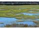 Enjoy views from the porch at 300 Marsh Pl. # 302A, Garden City Beach, SC 29576