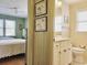 This hallway view highlights the bedroom to the left and the bathroom on the right with artwork in between at 312 Norris Dr., Pawleys Island, SC 29585