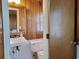 Bathroom features a vintage sink and toilet, compact and clean at 312 Norris Dr., Pawleys Island, SC 29585
