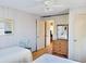 Bright bedroom with two cozy beds, natural light, hardwood floors, and classic wood dresser at 312 Norris Dr., Pawleys Island, SC 29585