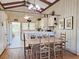 Charming kitchen with bar seating, white cabinets, and hardwood floors at 312 Norris Dr., Pawleys Island, SC 29585