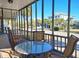 Relaxing screened porch with comfortable seating and neighborhood view at 312 Norris Dr., Pawleys Island, SC 29585