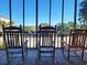 Relax on the porch with rocking chairs and enjoy beautiful neighborhood views and sunny skies at 312 Norris Dr., Pawleys Island, SC 29585