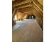 Spacious attic featuring exposed wooden beams with room for storage at 3534 Carter Rd., Loris, SC 29569
