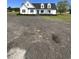 Charming two-story home with black shutters, landscaping and a circular driveway at 3534 Carter Rd., Loris, SC 29569