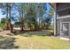 Lush backyard showcasing mature trees and partial exterior of the home at 366 Pinehurst Ln. # 13E, Pawleys Island, SC 29585