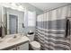 Bathroom featuring neutral-toned walls and a shower-tub combo at 366 Pinehurst Ln. # 13E, Pawleys Island, SC 29585