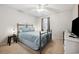 Comfortable bedroom featuring a queen bed, ceiling fan, and ample natural light at 366 Pinehurst Ln. # 13E, Pawleys Island, SC 29585