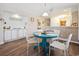 Open-concept dining area with a charming table, flowing into the kitchen at 366 Pinehurst Ln. # 13E, Pawleys Island, SC 29585