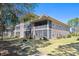 Charming condo building with screen porches and well-maintained landscaping at 366 Pinehurst Ln. # 13E, Pawleys Island, SC 29585