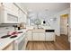 Well-lit kitchen with white appliances and a seamless flow to the living area at 366 Pinehurst Ln. # 13E, Pawleys Island, SC 29585