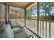 Cozy screened porch with comfortable seating area overlooking a lush green lawn at 366 Pinehurst Ln. # 13E, Pawleys Island, SC 29585