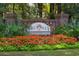 Welcoming True Blue Plantation sign with vibrant flowers and greenery at 366 Pinehurst Ln. # 13E, Pawleys Island, SC 29585
