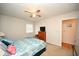 Comfortable bedroom features ceiling fan, dresser, natural light, and closet access at 4150 Horseshoe Rd. N # 8, Little River, SC 29566