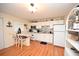 Bright kitchen with white cabinets, breakfast bar, complete with modern appliances and decor at 4150 Horseshoe Rd. N # 8, Little River, SC 29566
