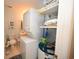 Laundry room with stacked washer and dryer, plus shelving for towels at 4150 Horseshoe Rd. N # 8, Little River, SC 29566