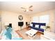 Inviting living room with wood floors, ceiling fan, and natural light from the windows at 4150 Horseshoe Rd. N # 8, Little River, SC 29566