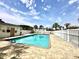 Community pool area with palm trees, lounge chairs and a security gate at 4150 Horseshoe Rd. N # 8, Little River, SC 29566